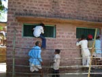 Visitors Climb Wall to Look Through a Window of Tiger Cage