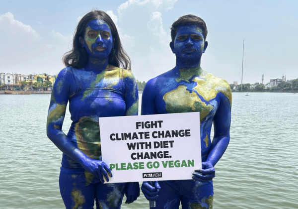 Body-Painted Pair Resembling Planet Earth Call for Vegan Meals Ahead of World Environment Day 